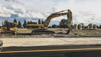 File photograph of Caterpillar excavator; industry context, not the Massy transaction or a Trinidad site.