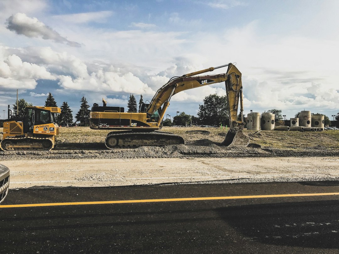 File photograph: Caterpillar excavator, published 26 August 2017; industry context, not Massy’s assets or a verified Trinidad site.