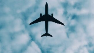 File photograph of an aircraft silhouette; aviation context, not a verified Caribbean Airlines aircraft.