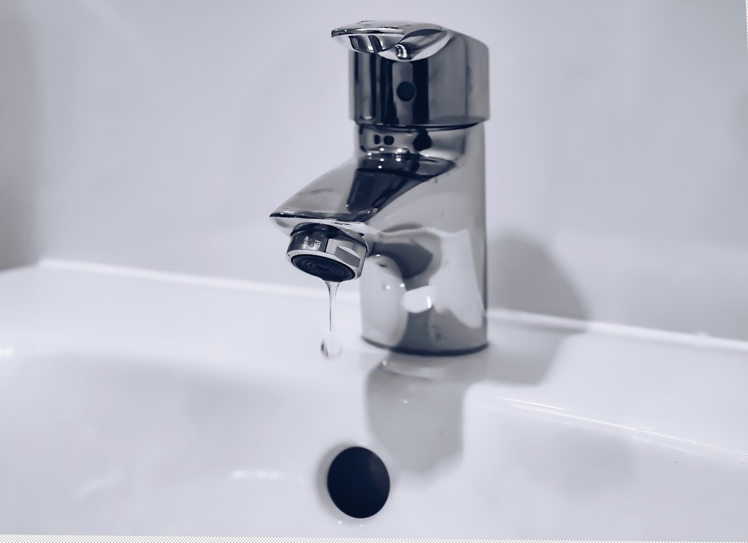 File photograph: dripping household tap; water-supply context, not Desalcott or an affected Trinidad household. Photograph date unknown.